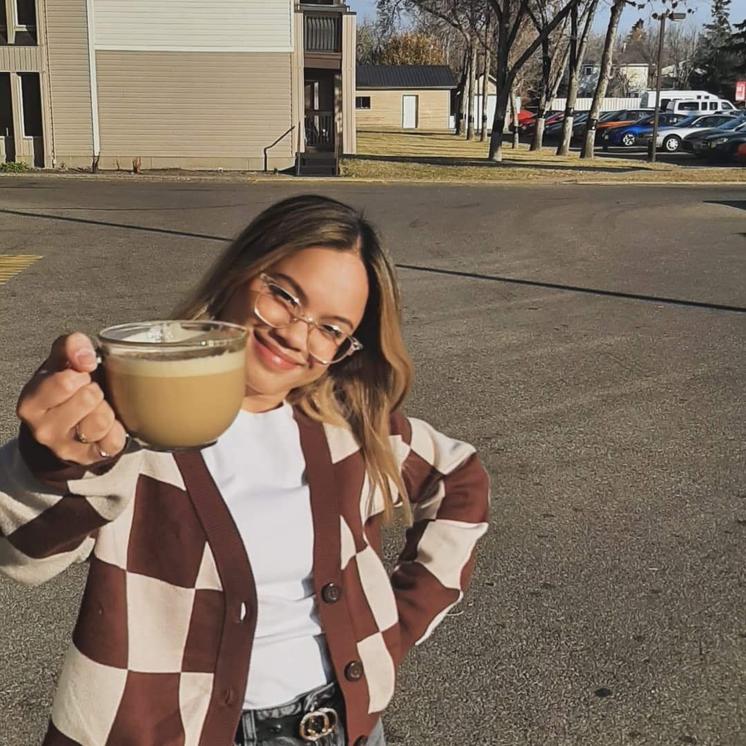 woman beside white vehicle during daytime