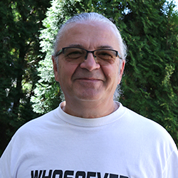 a man wearing a hat and glasses