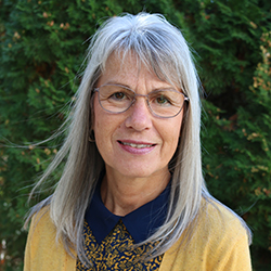woman wearing gray denim jacket and black scarf