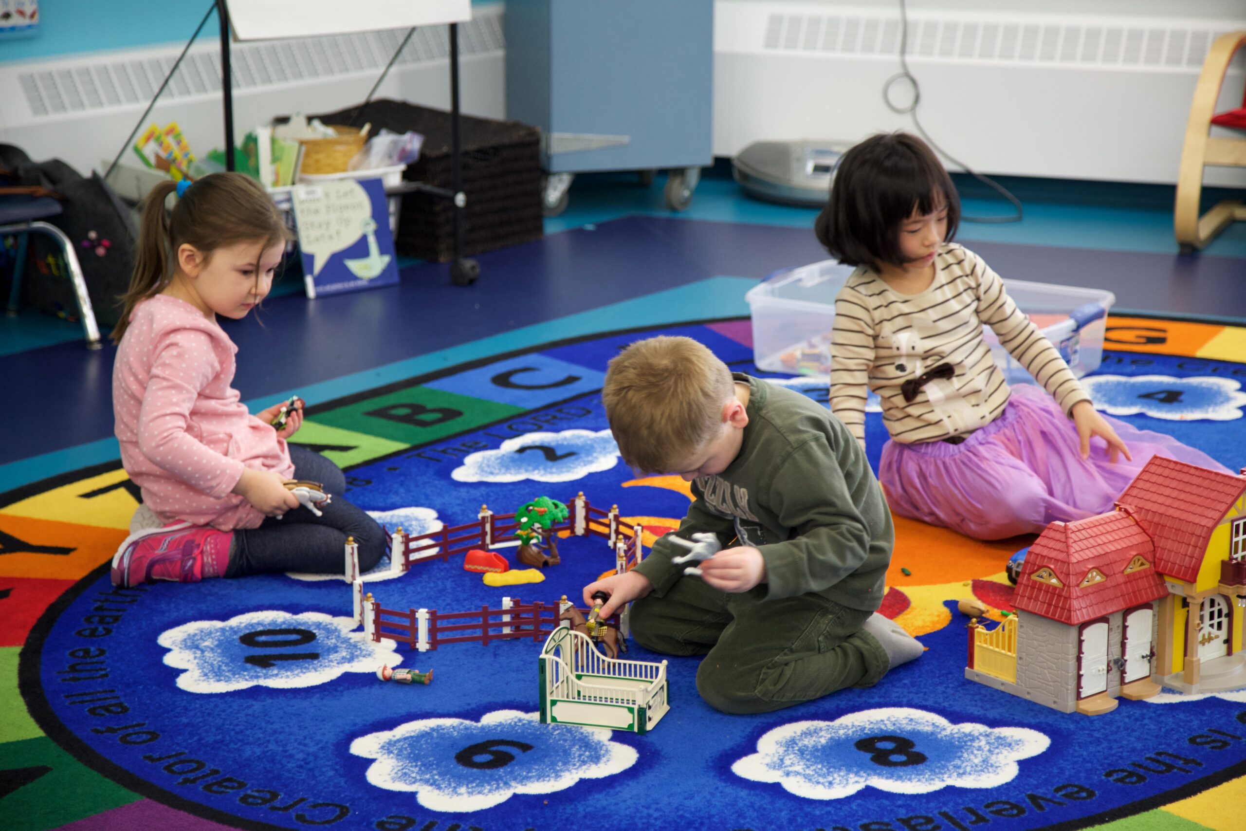 babys feet on white textile